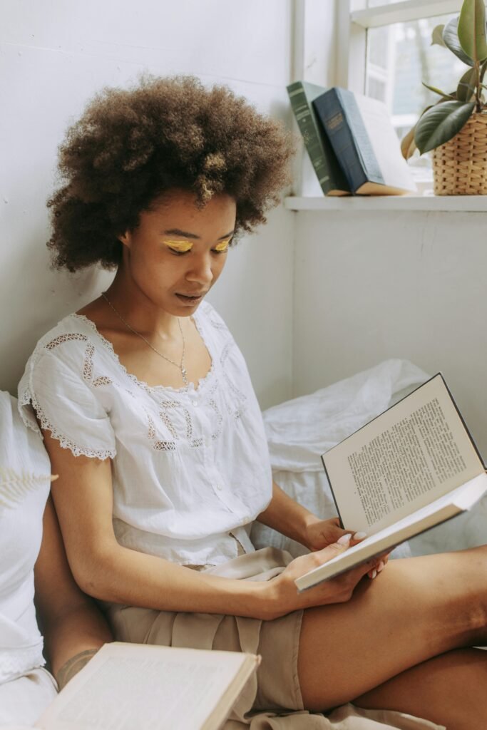 Woman Sitting and Reading A Book